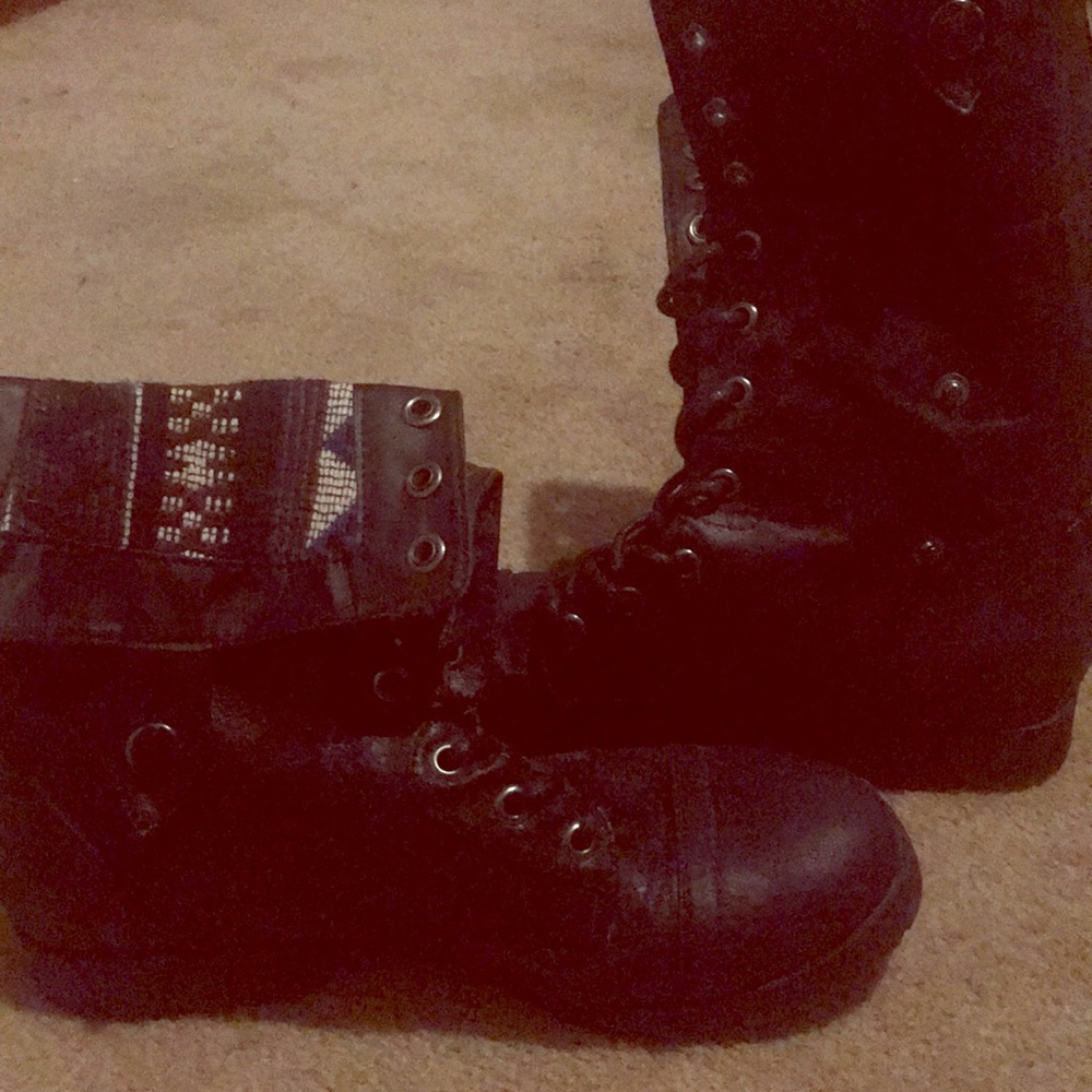 A pair of black boots, calf height.